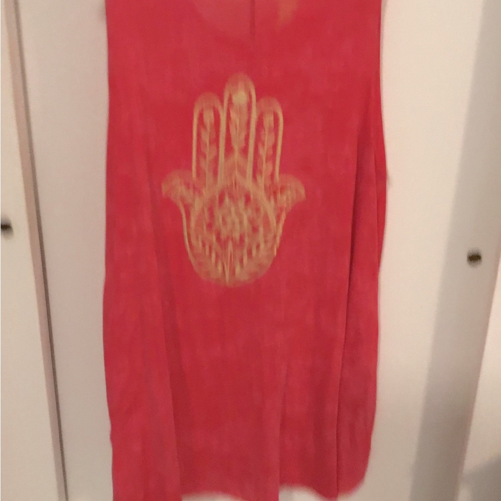 Light top with gold hand of God